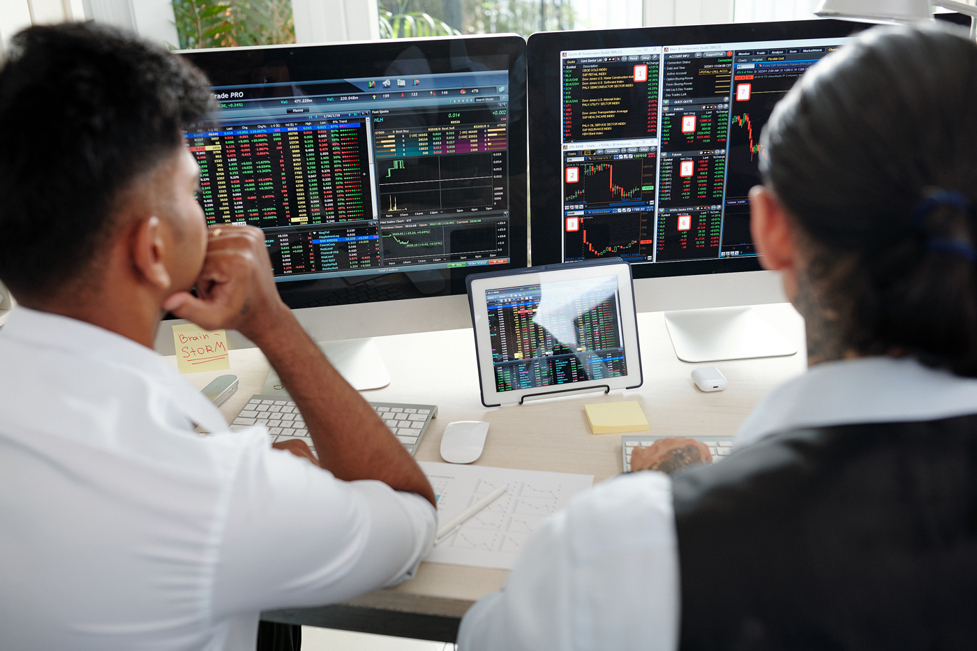 Trader reviewing stock charts, stock price action, learning to trade
