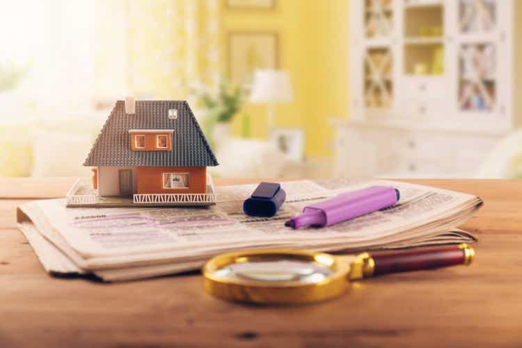 searching new house in newspaper real estate classifieds