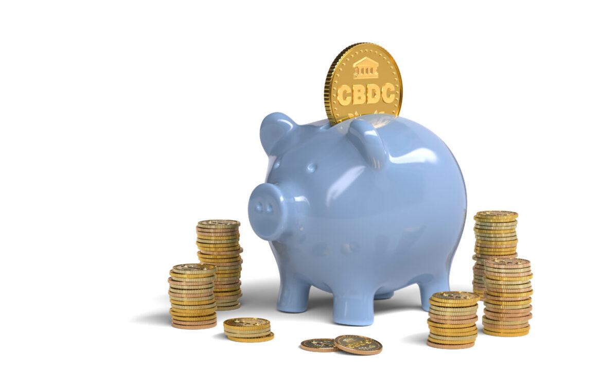 CBDC coin and piggy bank on white background