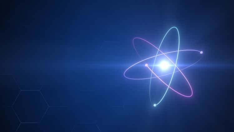 Unstable Atom nucleus with electrons spinning around it technology background