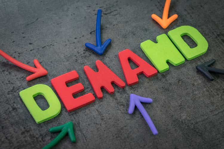 Demand, quantities of a commodity or a service concept, multiple arrow pointing to colorful alphabet building the word DEMAND at the center, in economics it