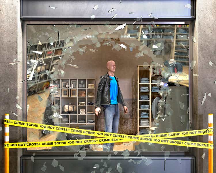 Destroyed boutique showcase broken on pieces of glass, crime tape beside and mannequin behind, concept of vandalism, robbery, 3d illustration